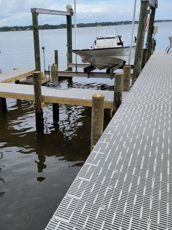 New construction dock with ventilated decking and boatlift near Grayton Beach, Florida